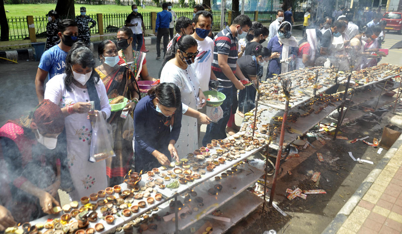 Guwahati: Devotees lighting earthen lamps and incense sticks while offering worship to Lord Ganesha