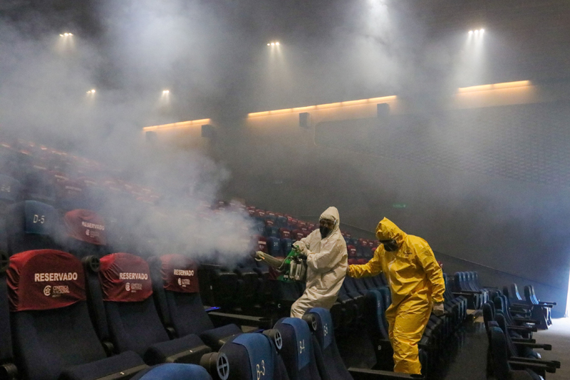 Workers sanitize movie hall in Mexico City