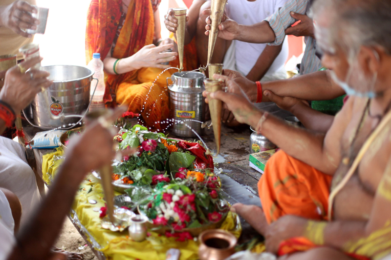 Shravan: Pilgrims performing Hawan after rudrabhishek to Lord Shiva