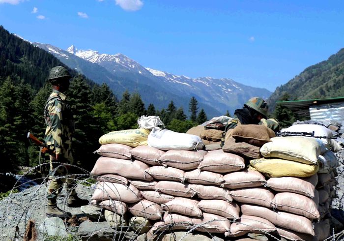 BSF soldiers guarding Indian troops moving to Galwan Valley in Ladakh on Srinagar-Leh national highway 