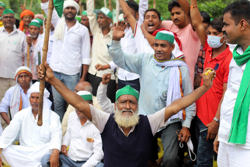 Prayagraj: Bharatiya Kishan Union workers block National Highway to protest against Farm Bills