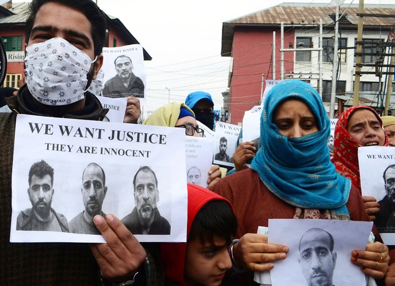 Family members of men arrested by Delhi Police protest in Srinagar