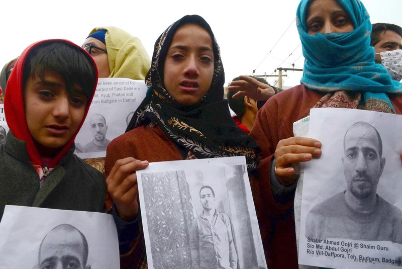 Family members of men arrested by Delhi Police protest in Srinagar