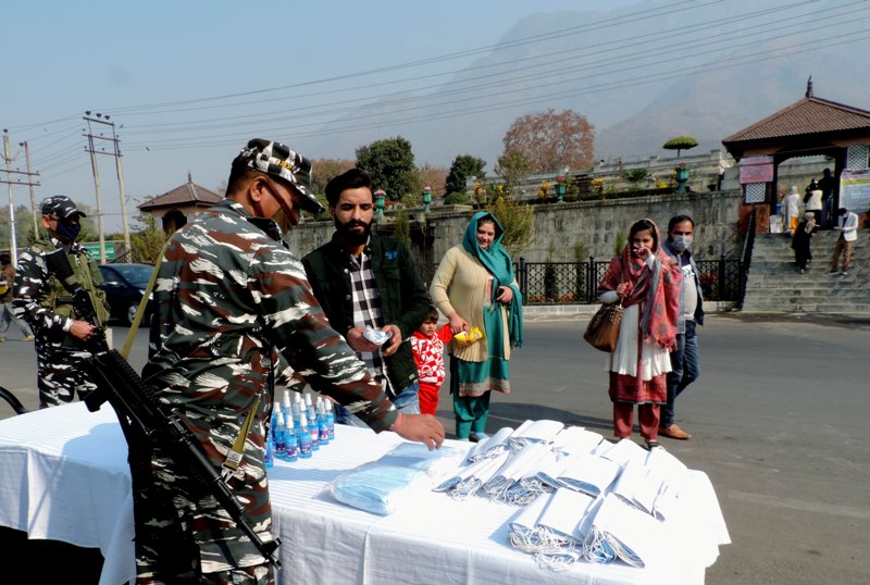 CRPF jawans provides face masks and sanitizer to the local tourists in Srinagar