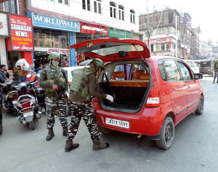 Srinagar: Security personnel checking vehicles at Lal Chowk