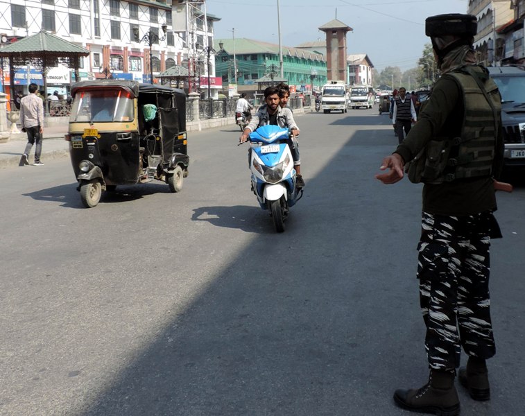 Srinagar: Security personnel checking vehicles at Lal Chowk