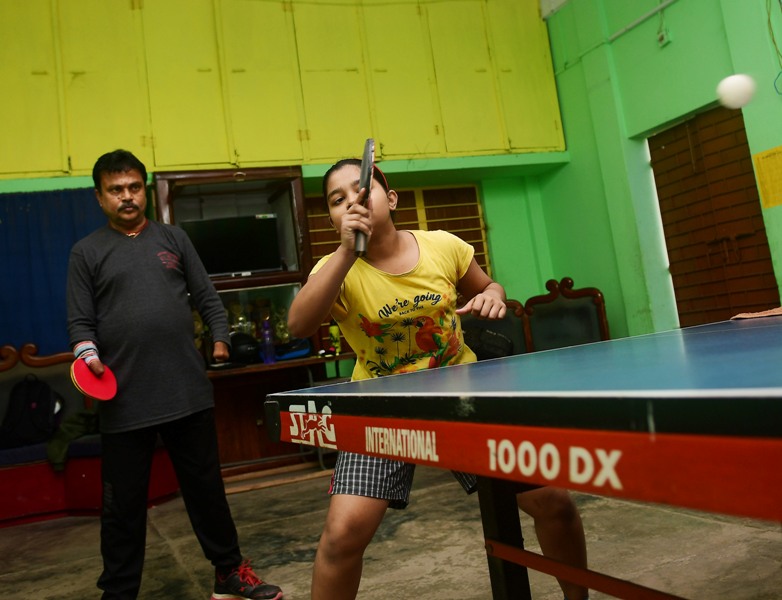Disabled table tennis player Kajol Dey with his students on International Day of Persons with Disabilities in Agartala