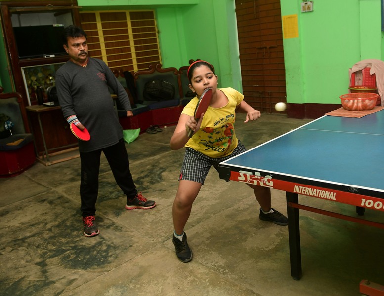 Disabled table tennis player Kajol Dey with his students on International Day of Persons with Disabilities in Agartala