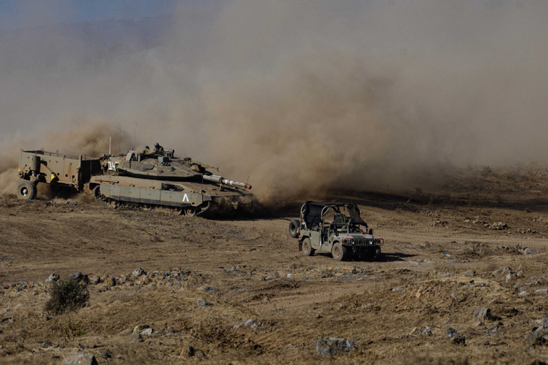 Israeli soldiers drive military vehicles during an exercise in the Israel-occupied Golan Heights