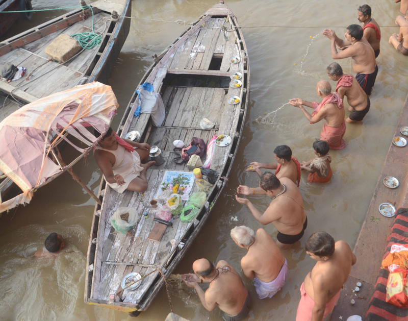 People performing Tarpan rituals during Pitra Paksha at river Ganga in Varanasi
