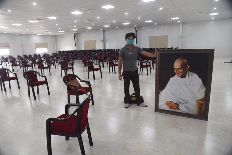 Nitish Kumars virtual rally: Worker carries Gandhi's portrait