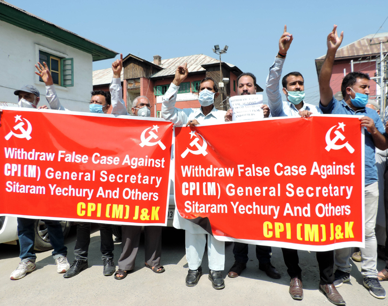 CPI(M) activists agitate demanding withdrawal of cases against party General Secretary Sitaram Yechury
