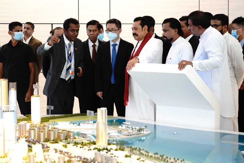 Sri Lankan Prime Minister Mahinda Rajapaksa listening to the latest report on the construction of Port City project in Colombo