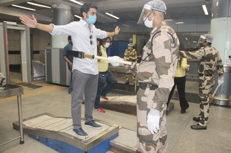 DMRC workers sanitizing Rajiv Chowk Metro Station ahead of resumption of metro services