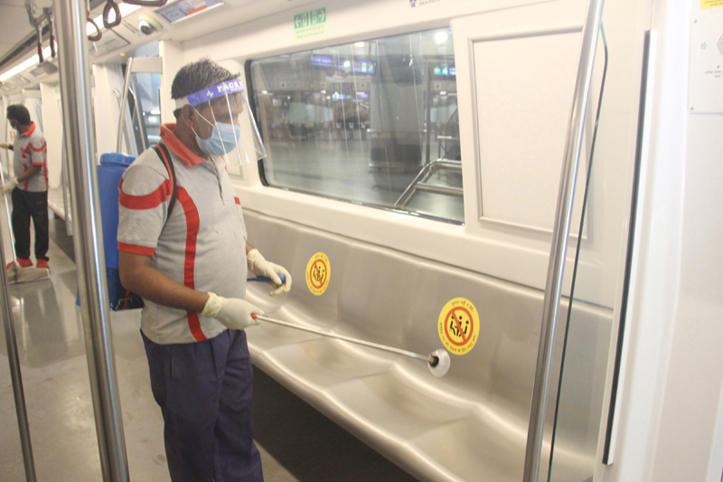 DMRC workers sanitizing Rajiv Chowk Metro Station ahead of resumption of metro services