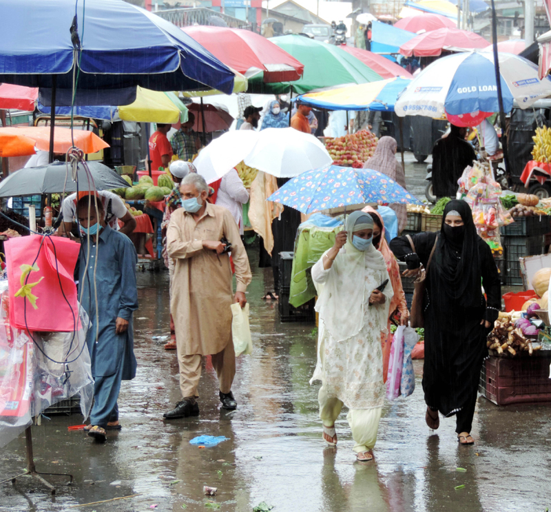 People walking down the Lal Chowk in Srinagar