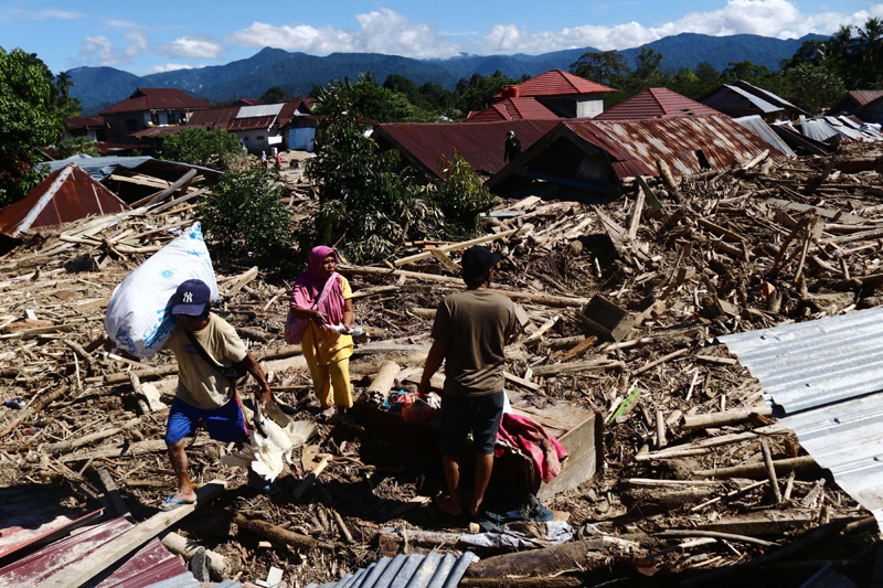 Indonesia: People salvage items after flash floods hit Masamba