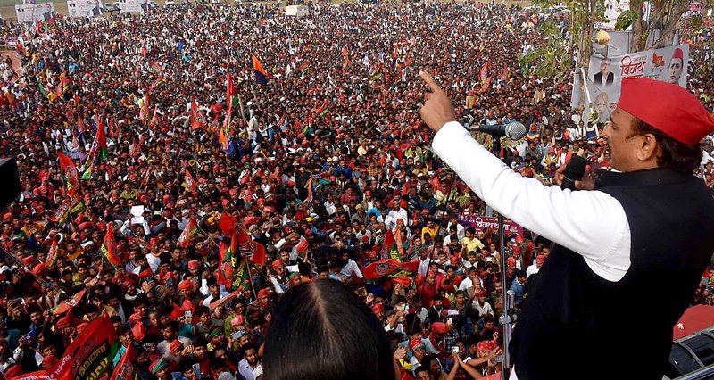 Akhilesh Yadav waves to supporters during tour to five Assembly constituencies in UP