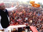 Akhilesh Yadav waves to supporters during tour to five Assembly constituencies in UP