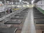 COVID-19: Worker prepares beds at Patliputra Sport Complex
