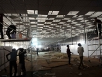New Delhi: Workers constructing temporary COVID-19 care centre