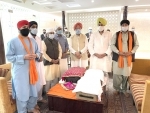 Hardeep Singh Puri receiving Sri Guru Granth Sahib