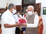 Kerala Chief Minister Pinarayi Vijayan receiving bouquet from Kerala Governor Arif Mohammed Khan