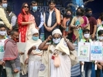 Rakshak Foundation distributes masks, cotton bags to Gangasagar devotees