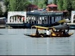 Tourists taking a shikara ride in Srinagar's Dal Lake