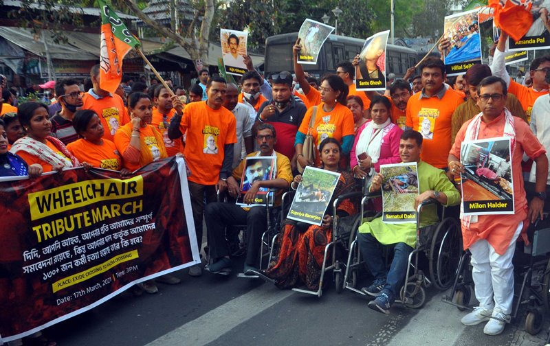 BJP workers in a 'Wheelchair Tribute March' attacking West Bengal CM Mamata Banerjee