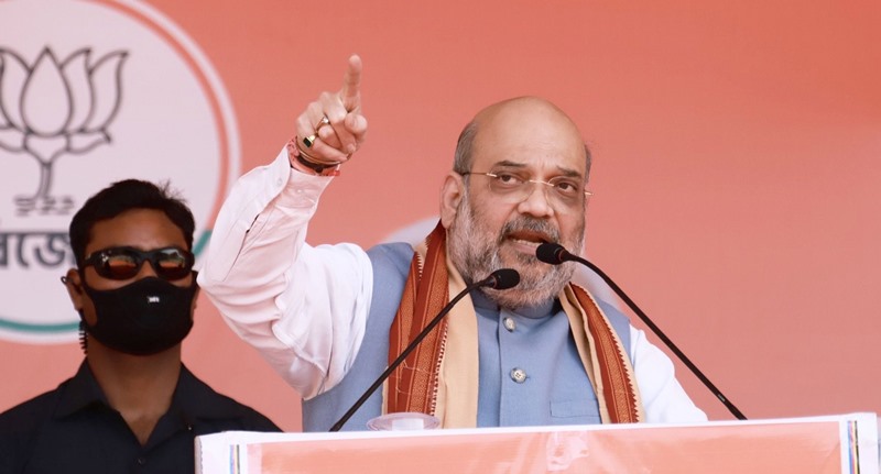 Amit Shah waves at the crowd in election rally in West Bengal