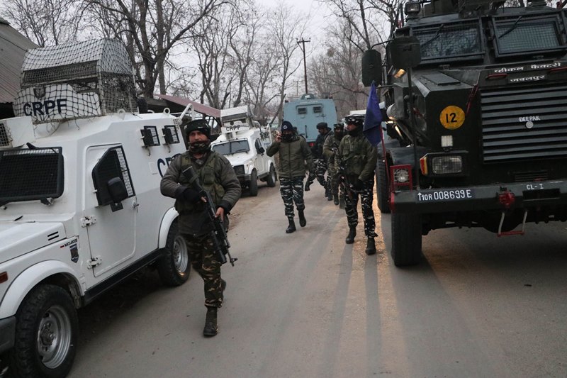 Security personnel takes position during encounter with terrorists in J&K's Pulwama