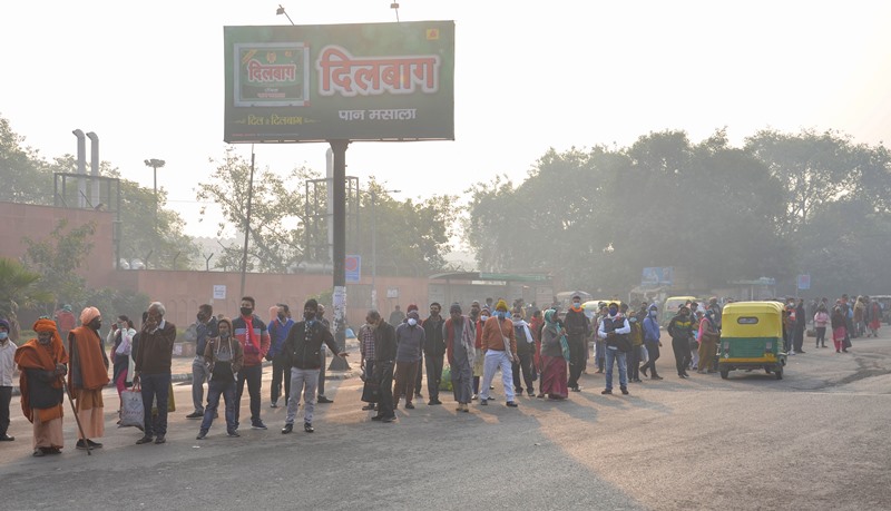 People travel amid COVID-19 spike in Delhi