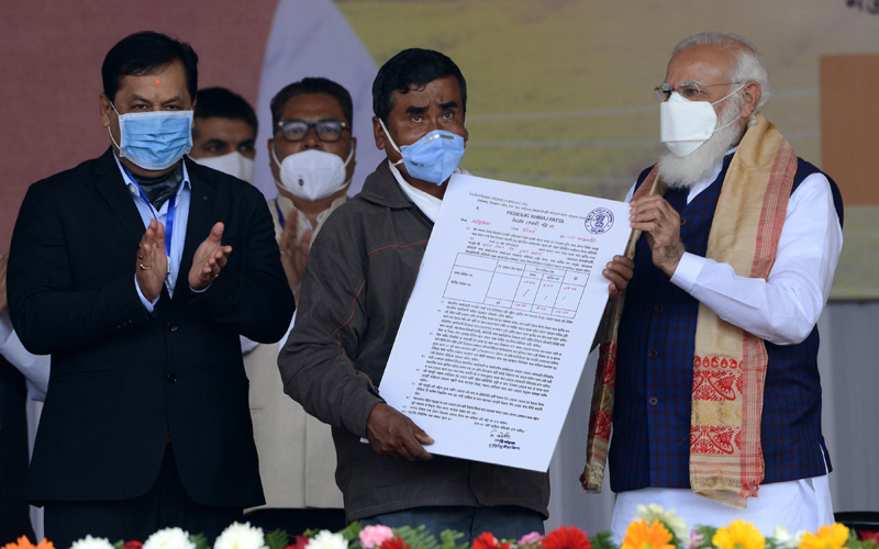 Assam: Naredra Modi distributes land patta to landless people during public meeting