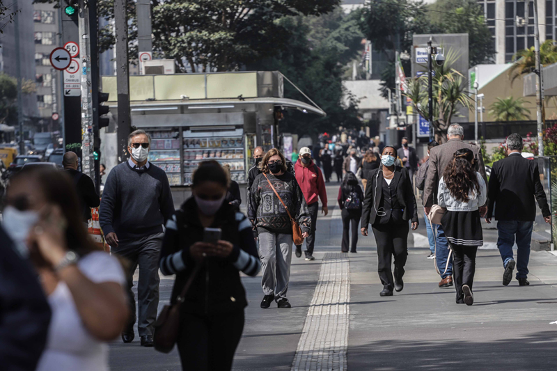 Glimpse of people walking on a street of Sao Paulo in Brazil amid the COVID-19 outbreak
