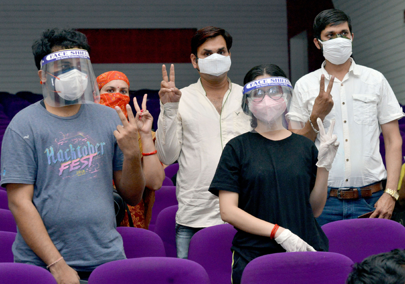 Jabalpur: Young people show victory sign after receiving COVID19 vaccine first dose
