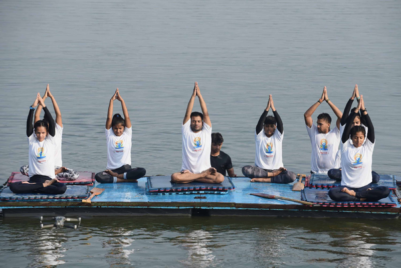 Students of a Water Club perform Yoga