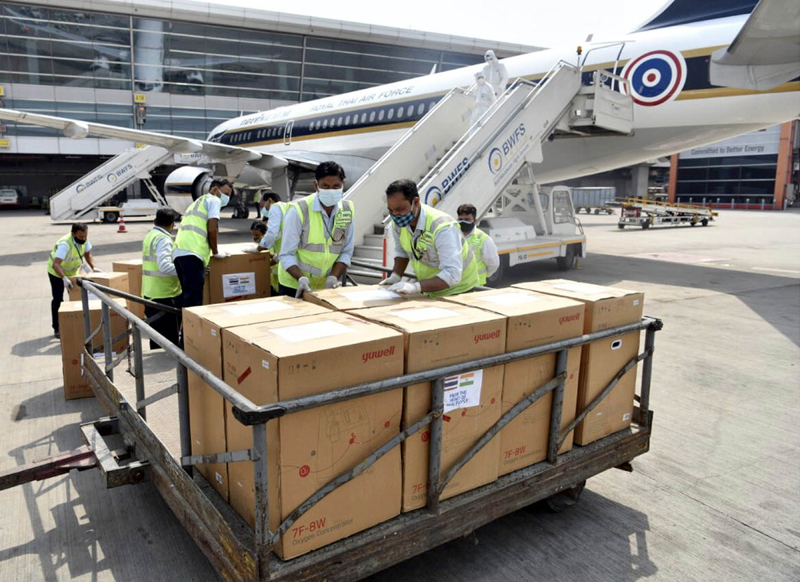 Workers loading emergency medical supplies from Thailand