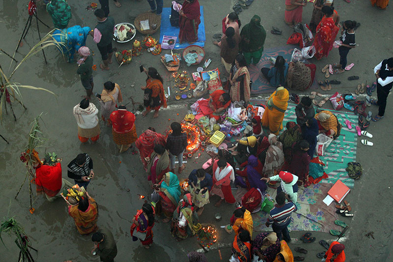 Chhath devotees worshipping the rising sun in Prayagraj