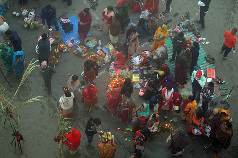 Chhath devotees worshipping the rising sun in Prayagraj