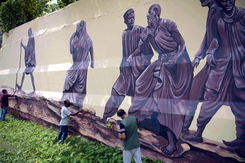 Artists painting on walls as part of Azadi Ka Amrit Mahotsav in Agartala