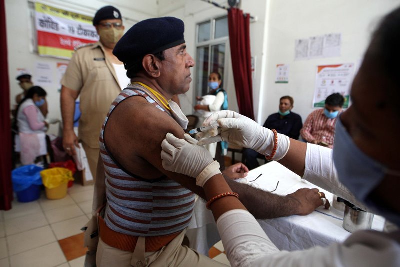 Officer receiving COVID-19 vaccine in Prayagraj