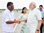 AIADMK Coordinator O Panneerselvam greets PM Modi at Chennai Airport