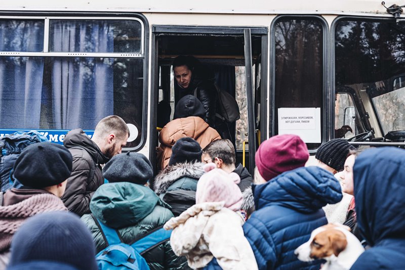 People board bus in war-hit Ukraine
