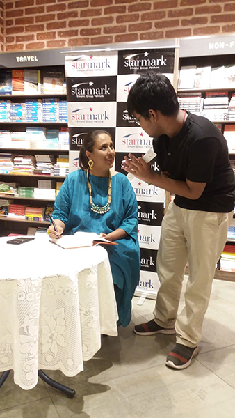 Barkha Dutt signs her latest book To Hell And Back in Starmark Kolkata