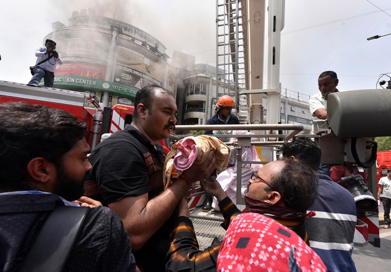 Firefighters rescue child patients after fire breaks out at Ahmedabad hospital