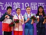 Indian boxer Nikhat Zareen posing with winners of Women's 45-50 Kg Boxing event at Asian Games