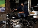 Aditya Roy Kapur takes care of his bike on Sunday