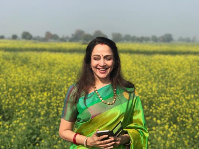 Hema Malini enjoys sometime in mustard fields