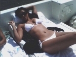 Kim Kardashian shares white bikini image of herself on social media